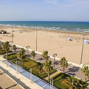 Beach of Malvarossa during the day with the sun and the sand