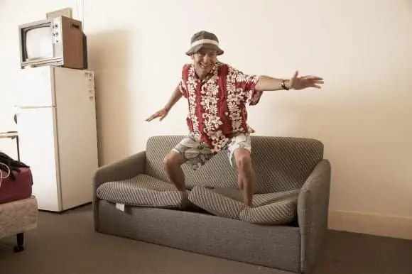 Men surfing on his sofa